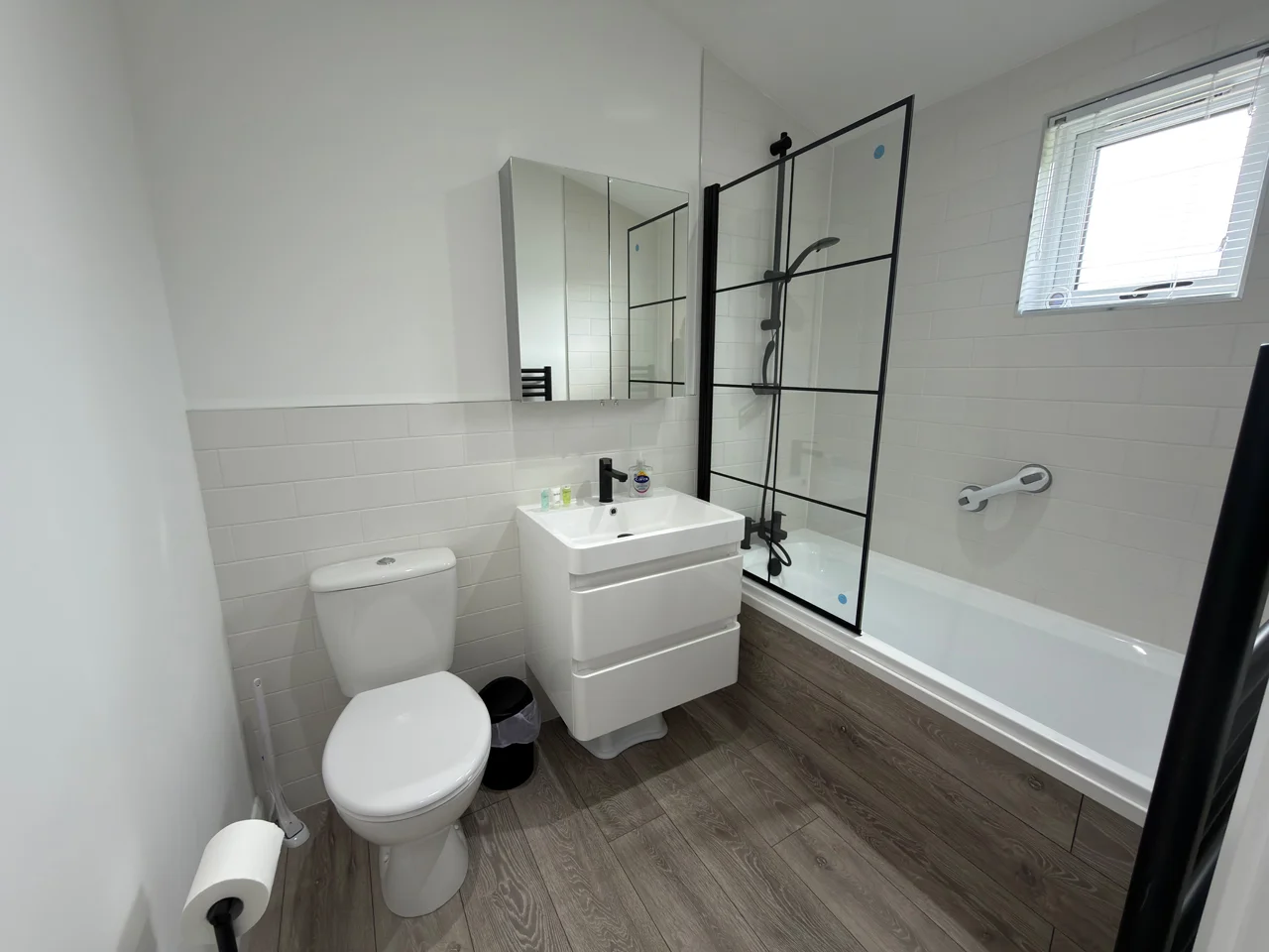 Brea Lodge ensuite - white - Bath / shower, wash handbasin, with drawers, and loo