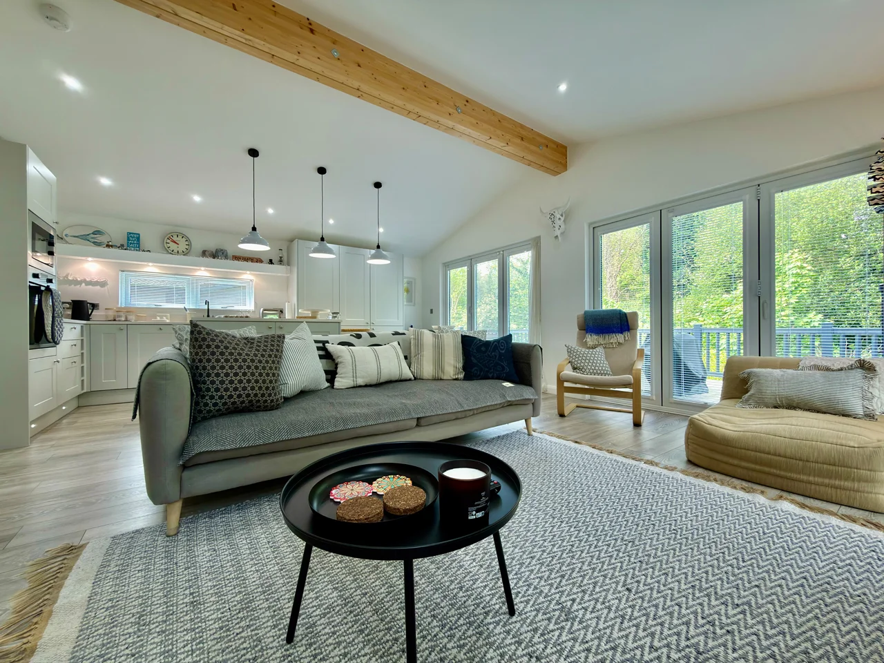 Brea Lodge Lounge - grey sofa, circular coffee table