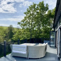 bespoke lodge decking with sumptuous patio furniture
